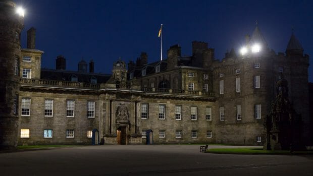 The Hollyrood Palace is brightly lit at night
