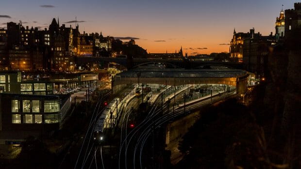 A train leaves Waverley Station in the evening