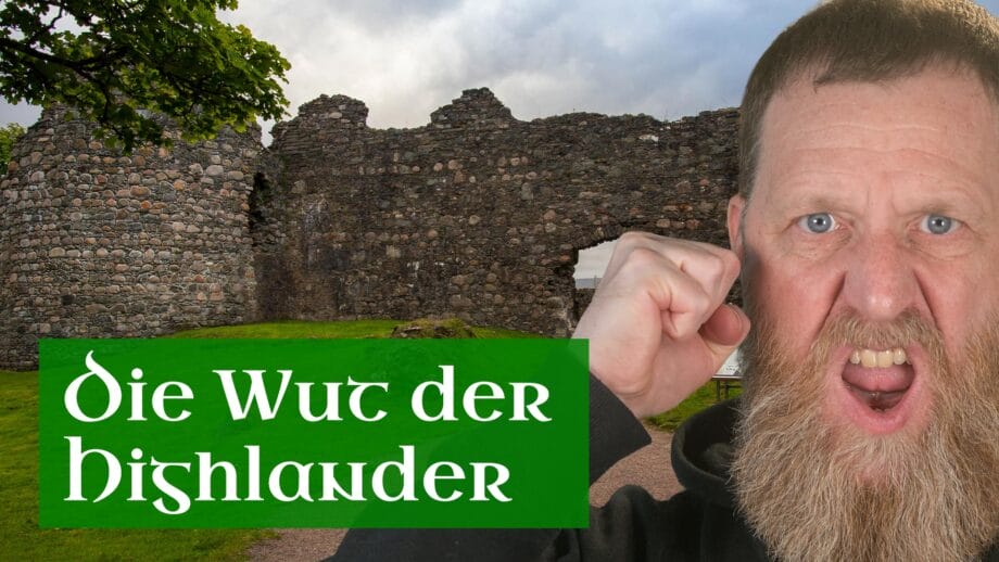 Ein bärtiger Mann schreit wütend, im Hintergrund steht eine Burgruine.